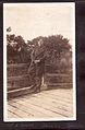 "Sgt C. Devos, Dorval, Quebec" Sergeant Devos standing on a wooden bridge. (3548756979).jpg