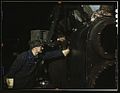 Working on the cylinder of a locomotive 1a34608v.jpg