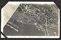 "Deseronto from the Air", aerial photograph of Deseronto, Ontario, taken in around 1917. The cedar mill is visible in the bottom centre of the photograph, with the car works and marine railway to the (7980847567).jpg